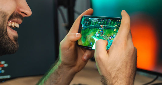 Blind man playing game on the phone