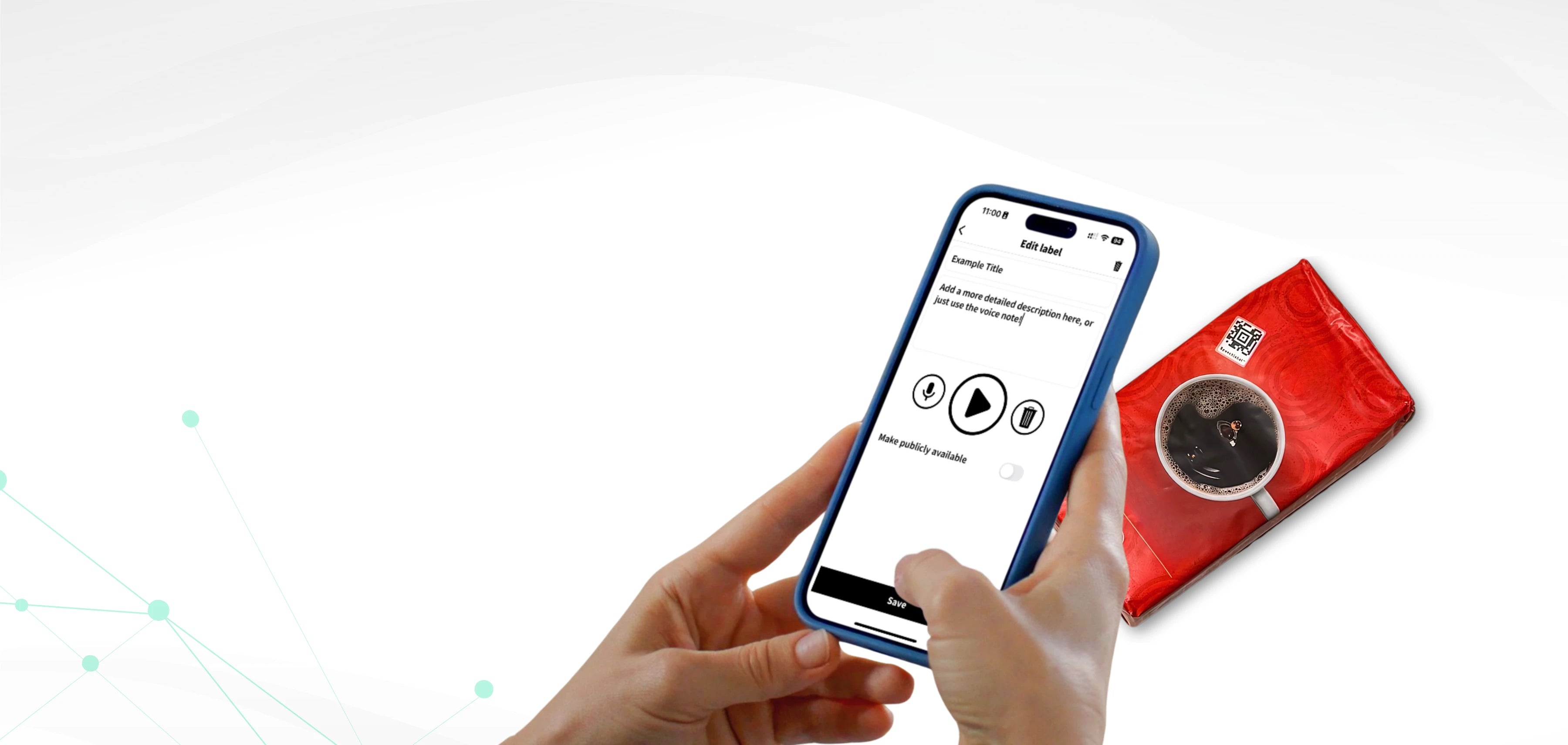 On a clean white background, a pair of hands holds a smartphone displaying the Speechlabel app in editing mode. The screen shows options to record or play an audio message and to save the label. On the right side lies a red package of coffee with a white cup of black coffee printed on it. At the top of the package is a square black-and-white Speechlabel grocery sticker with a red border, clearly visible.