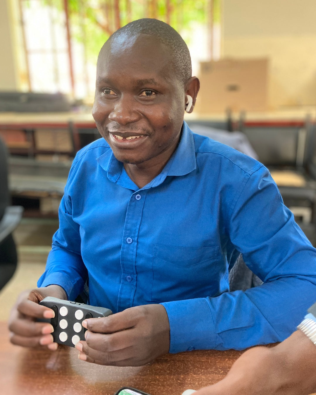 Man smiling and using his Hable One