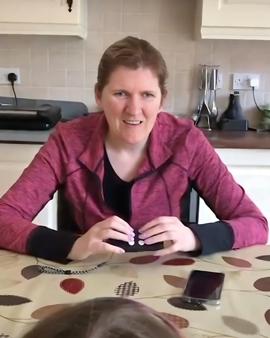 Woman smiling and using her Hable One.