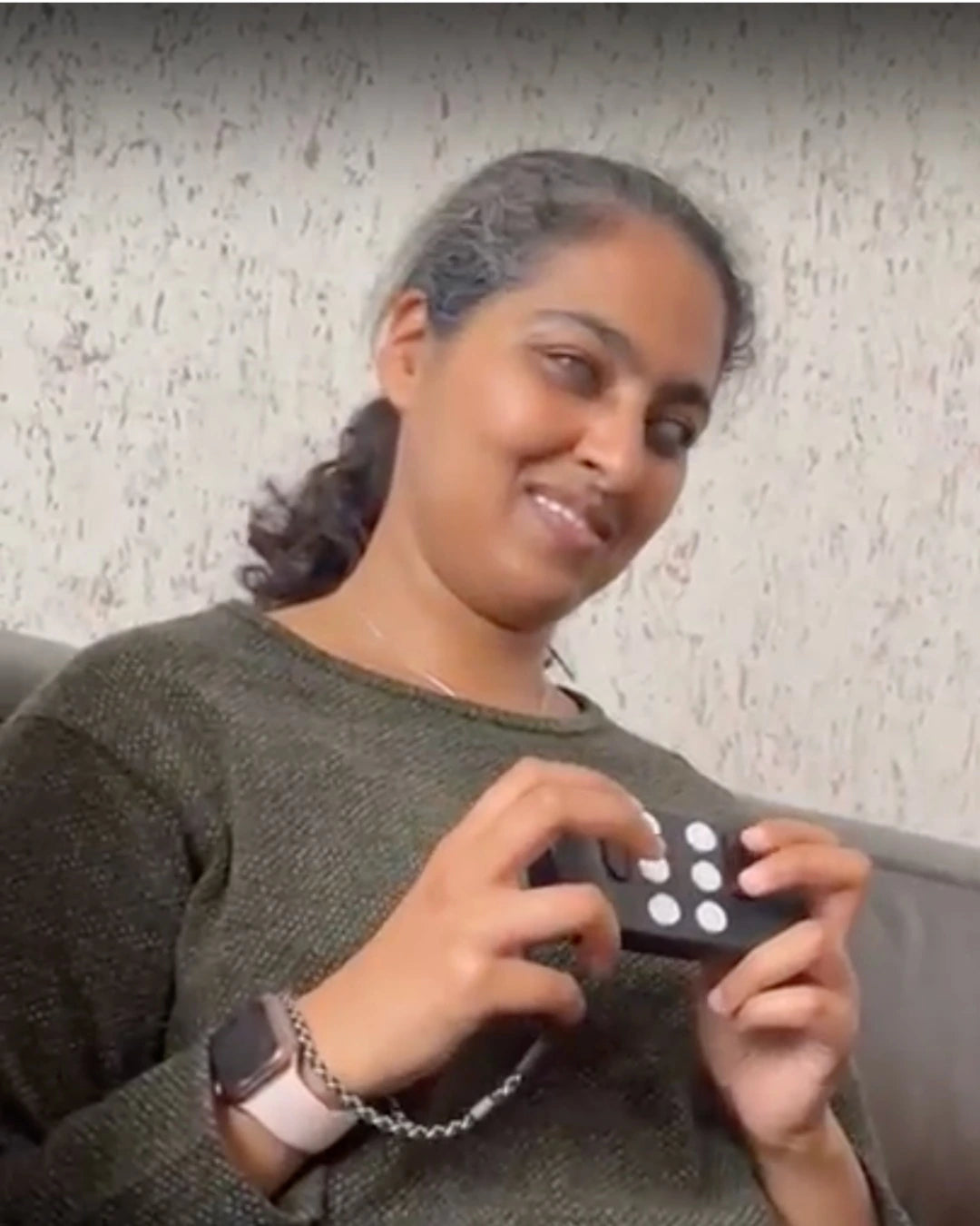 Woman smiling and using her Hable One.