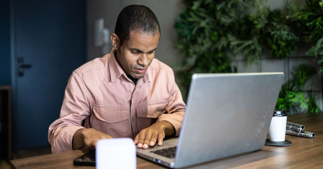 Blind man working on the computer
