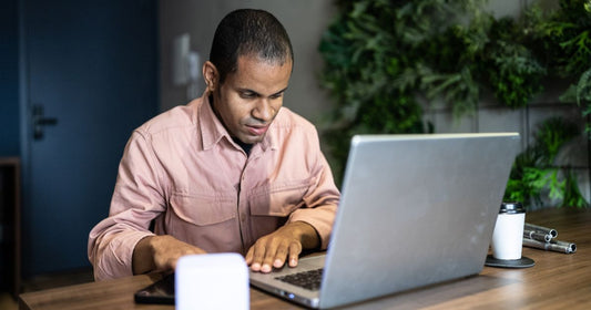 Blind man working on the computer