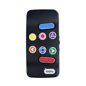 Front view of the Hable Easy. We see a black remote control like device with white buttons. On the buttons bright high contrast tactile stickers are added with a set of different shapes to identify each button. 