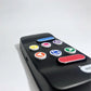Side view of the Hable Easy, showing high contrast Tactile stickers on the buttons. Ranging from arrows, to circles to textures surfaces.