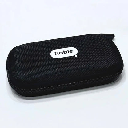 Closed black hard-shell Hable carry case with a woven fabric texture, rounded corners, and a white oval "hable" logo in the center top.