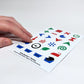 Angled perspective photo of a hand feeling the raised laundry cycle icons and water level symbols on the "Hable Stactiles - Washing" sticker sheet.