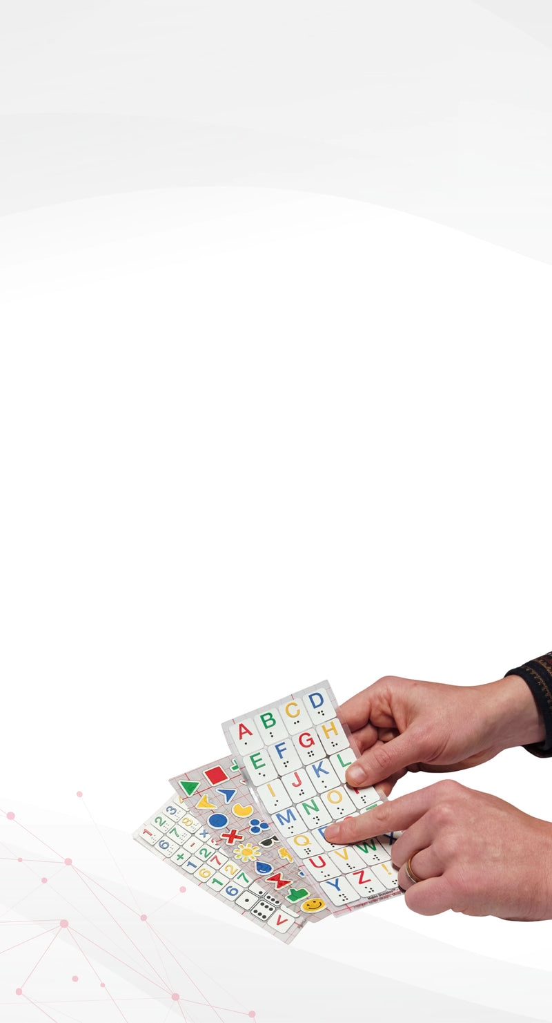 Hands holding a colorful alphabet card with letters and symbols on a white background. Showing different type of Stactile Stickers.