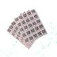 Sheet of QR code stickers on a white background with a network diagram.