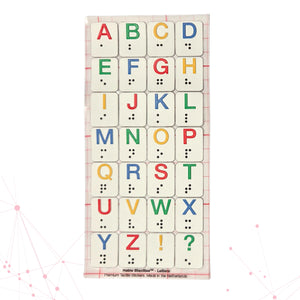 A Stactiles Letters sheet featuring raised tactile stickers of the alphabet, each letter printed in bright colors with matching braille dots underneath. The stickers are arranged in a neat grid on a transparent backing.