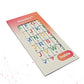 A packaged Stactiles Letters sheet featuring raised, colorful alphabet stickers with braille dots. The packaging has a pink-to-orange gradient border and a window showing the tactile letters, with the Hable logo in the bottom corner.