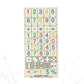 A Stactiles Numbers sheet featuring raised tactile stickers of numbers, math symbols, dice patterns, and currency symbols. The stickers are arranged in neat rows on a transparent backing with a faint red grid.
